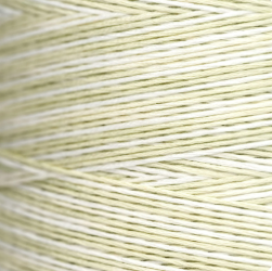 Close-up of a spool of light green thread
