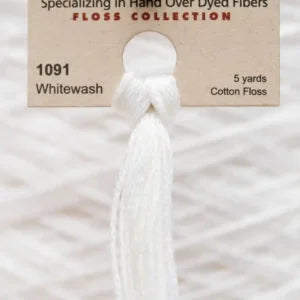 White cotton floss with a label indicating 'Whitewash' color and product details.