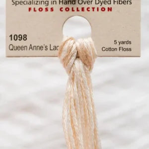Cotton floss tied into a knot with packaging labeled '1098 Queen Anne's Lace' on a white background.