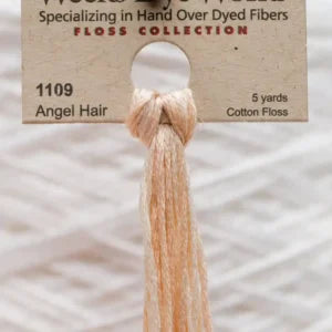 Skein of cotton floss labeled '1109 Angel Hair'.