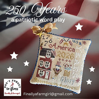 Patriotic cross stitch design featuring a small house, American-themed motifs, and text including 1776 2026 America and semiquincentennial in a decorative layout.