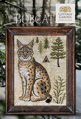 The Bobcat cross stitch pattern by Cottage Garden Samplings featuring a seated bobcat in a woodland forest scene, part 8 of the A Year in the Woods II series.
