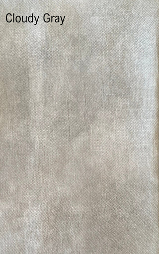 A close-up fabric swatch labeled 'Cloudy Gray' showing a light warm gray woven textile texture.