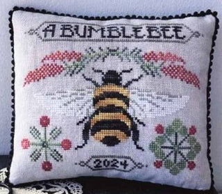 A Bumblebee cross stitch pattern with a bee, floral sprigs, berries, and decorative text by A Gardener’s Needle