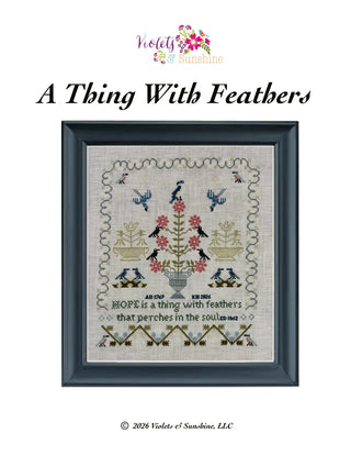 Framed cross-stitch pattern titled 'A Thing With Feathers' by Violets & Sunbeams on a white background.