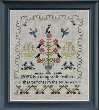 Decorative cross-stitch pattern with birds, flowers, and text on a light background.