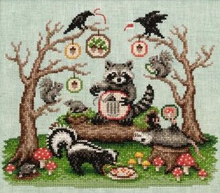 Cross stitch pattern of woodland animals including raccoons, squirrels, skunks, and birds gathered among mushrooms and acorns in a whimsical forest scene, designed by Lola Crow Cross Stitch.