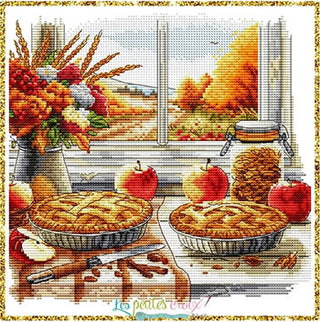 Cross-stitched pattern of two apple pies with autumn elements.