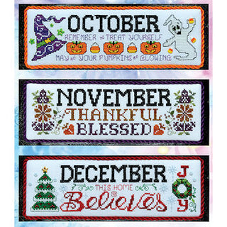 Three cross-stitched panels with seasonal text for October, November, and December.