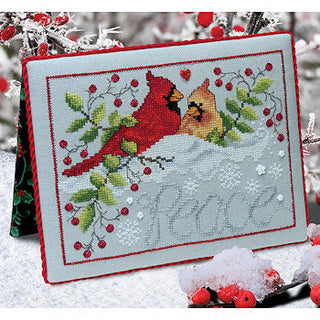 Cross-stitched card with cardinals and berries on a snowy background