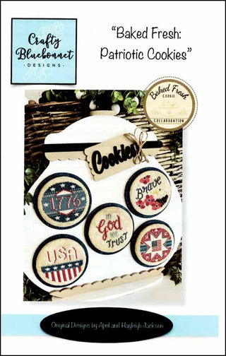 Set of patriotic cookies with decorative labels on a tray, featuring the Crafty Bluebonnet Designs brand.