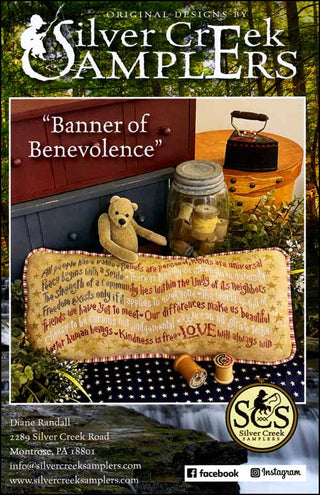 Advertisement for Silver Creek Samplers with a banner and teddy bear, set against a natural background.