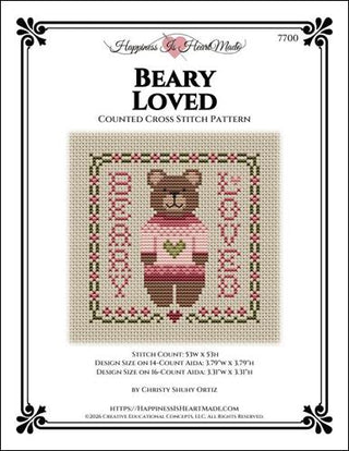 Cross stitch pattern for a bear with a heart design on a white background