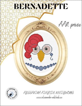 Cross-stitched portrait of a whimsical hen with round glasses, a red feather hairstyle, and a blue beaded necklace, displayed in an ornate oval gold frame.