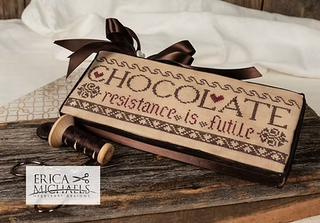 Chocolate Resistance cross stitch pattern by Erica Michaels featuring a playful chocolate-themed design with humorous wording about not resisting chocolate in a primitive folk style.