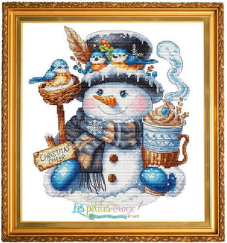 Cross-stitched snowman with birds and hot chocolate, framed in gold