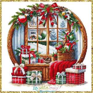 Decorative cross-stitch pattern of a Christmas scene with presents and a window view.