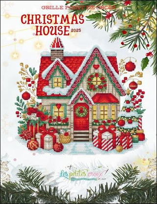 Cross-stitch pattern cover with a Christmas house design and festive elements.