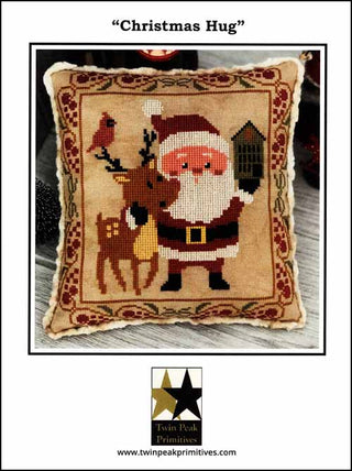 Decorative pillow with Santa Claus and reindeer design, featuring Twin Peak Primitives branding.