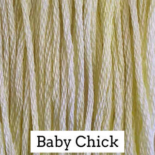 Close-up of pale yellow embroidery thread strands with a white label at the bottom reading 'Baby Chick'.