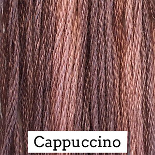 Close-up of twisted yarn strands in a warm medium brown tone labeled 'Cappuccino' on a white text box at the bottom.