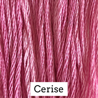 Close-up of pink embroidery thread strands with a white label at the bottom reading 'Cerise'.