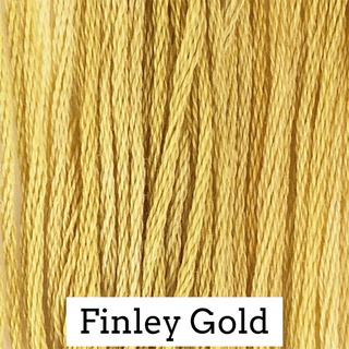 Close-up of embroidery thread with 'Finley Gold' label