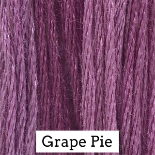Close-up of embroidery threads with 'Grape Pie' label