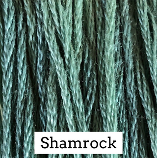Textured green embroidery floss swatch labeled 'Shamrock' on a white background