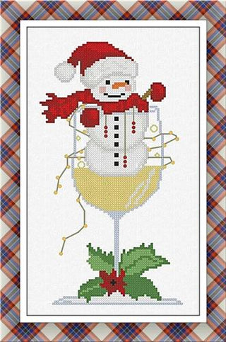 Cross-stitched design of a snowman in a glass with holly leaves and berries, framed by plaid patterns.