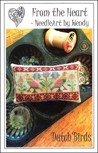 Pattern cover for Dutch Birds cross stitch pattern by From the Heart NeedleArt by Wendy featuring a horizontal folk art design with stylized birds and floral motifs in a sampler-style band, finished as a decorative pillow.
