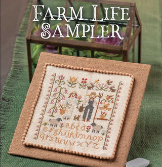 Cross-stitched sampler with farm life design on a green surface