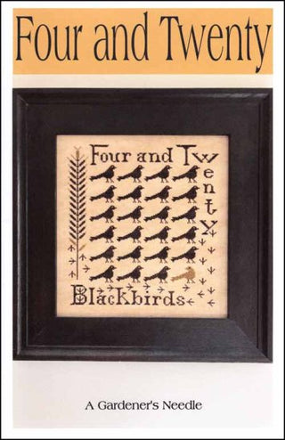 Framed cross-stitch pattern with 'Four and Twenty Blackbirds' text and design.