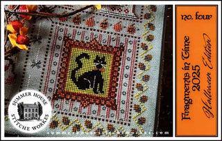Cross-stitched piece with a black cat design on fabric, alongside an orange book titled 'Fragments in Time 2025 Halloween Edition'.