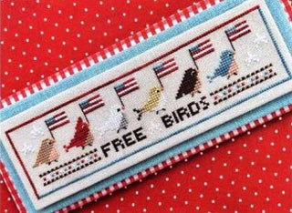 Cross-stitched label with birds and text on a red polka dot background