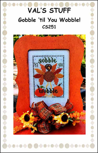 Gobble ’Til You Wobble cross stitch design by Val’s Stuff featuring a bright turkey with autumn feathers, pumpkins, and playful Thanksgiving lettering.
