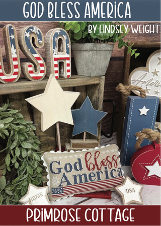 Decorative items with 'God Bless America' text and USA flag design on a wooden surface.