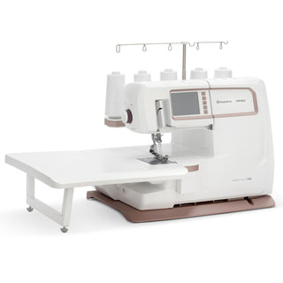 White sewing machine with a digital display on a white background