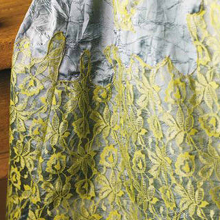 Gray fabric with yellow floral lace pattern