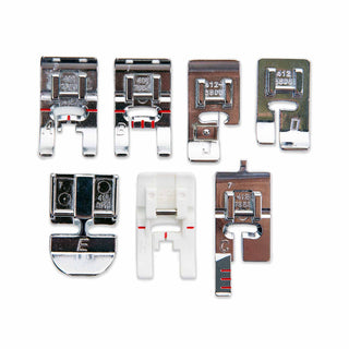 Set of various sewing machine presser feet on a white background