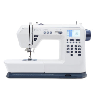 White sewing machine with digital display on a white background