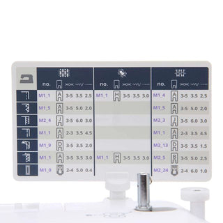 Sewing machine needle plate with various needle sizes and settings on a white background