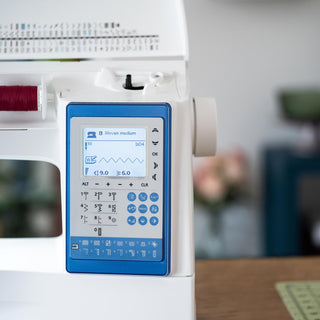 Sewing machine with digital display on a blurred background