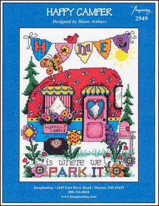 Cross stitch pattern of a red camper trailer with floral designs and a blue sky background.