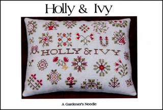 Finished cross stitch design featuring traditional Christmas holly and ivy motifs arranged in a festive sampler-style layout with seasonal colors and decorative accents.