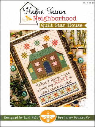 Quilt pattern cover with house design and text, featuring 'Home Town Neighborhood' branding.