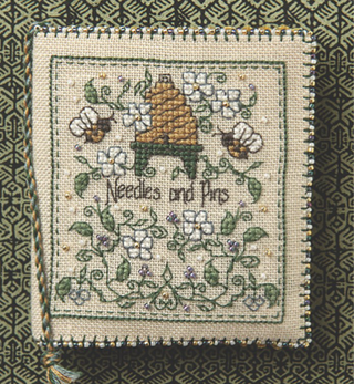 Decorative needlepoint with floral patterns and text on a textured background