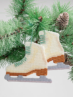 Just CrossStitch Magazine: 2025 Summer Edition. Ice Skates
Design by Vanessa Timko
Hang this pair of skates from a branch of your Christmas tree, then take a moment to reminisce about those cherished days spent gliding across the brisk ice.