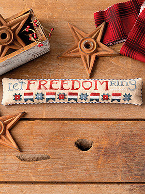 Just CrossStitch Magazine: 2025 Summer Edition. Let Freedom Ring
Design by Robin Sample of October House Fiber Arts
Get a head start on your patriotic celebrations! Stitch up this "skinny mini" pillow with just four colors of floss, and you'll be ready to let freedom ring.