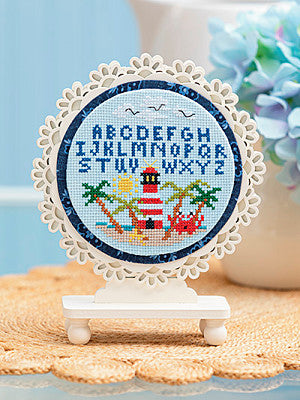 Just CrossStitch Magazine: 2025 Summer Edition. Mini Sampler Series: Summer
Design by Carrie Powell of Curious Carrie Designs
Decorate your home year-round with this unique series of designs. Each chart offers a playful glimpse into the unique motifs and vibrant colors of the current season. Add a quick-change finish for an amazingly easy addition to your home decor.